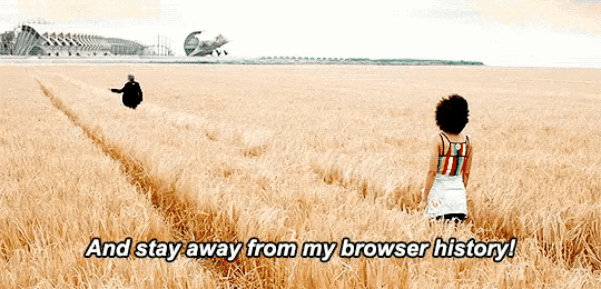 a woman standing in a field with the words " and stay away from my browser history " written below her