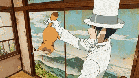 a man in a top hat is holding a small animal in his hand