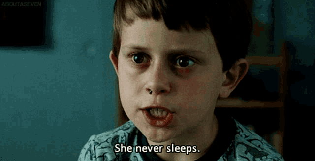a young boy says she never sleeps while making a face