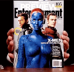 a person is holding a magazine that says x-men