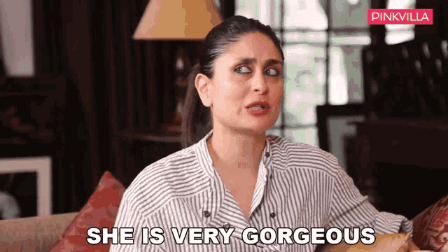 a woman sitting on a couch with the words she is very gorgeous