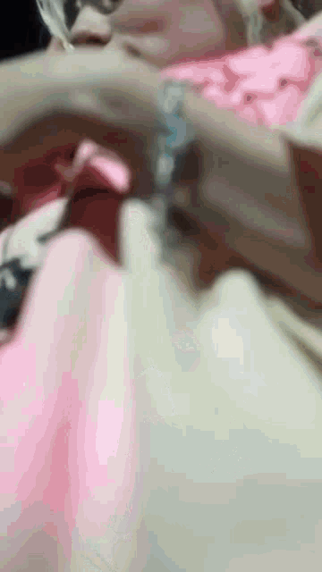 a close up of a person laying on a bed