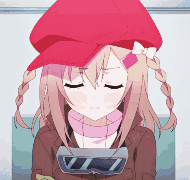 a girl with braids wearing a red hat and goggles