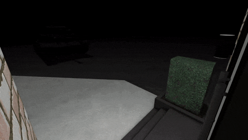 a black tank is sitting on a concrete floor