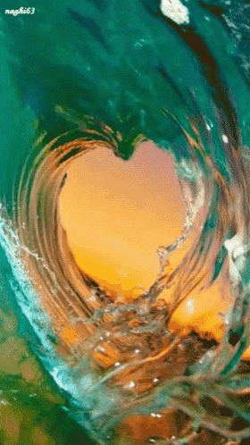 a heart shaped wave in the ocean with the name nagki163 on the bottom right