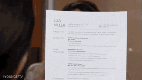 a woman is holding up a resume for liza miller