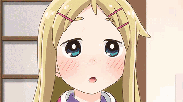 a cartoon girl with blonde hair and blue eyes is looking at the camera