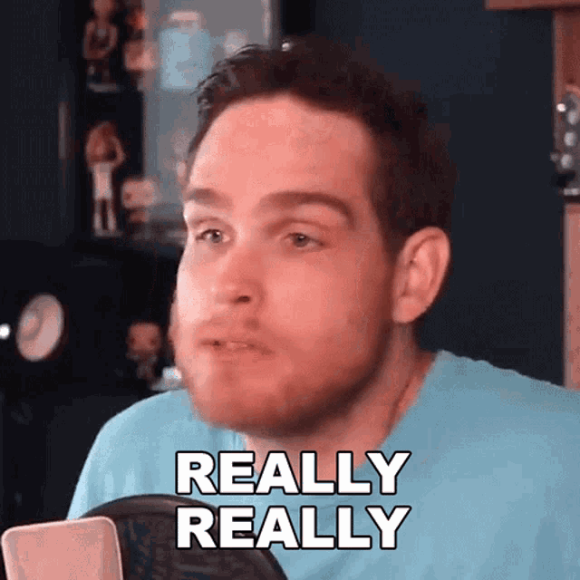 a man in a blue shirt says " really really "