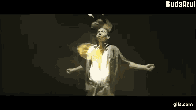 a gif of a man with a bird coming out of his chest that says " budaazul "