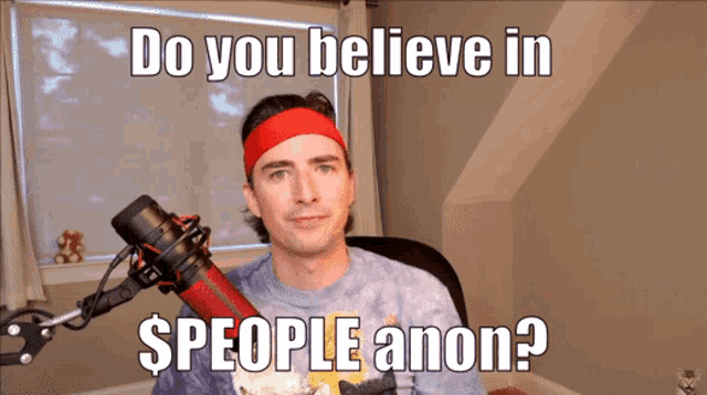 a man wearing a red headband stands in front of a microphone with the words do you believe in $ people anon