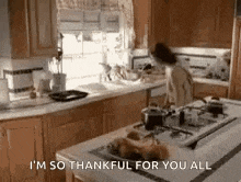 a woman is cooking in a kitchen and says `` i 'm so thankful for you all ''