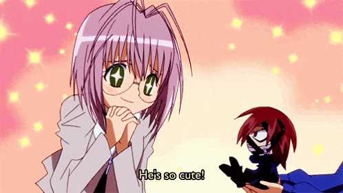 a girl with glasses says he 's so cute while holding a doll