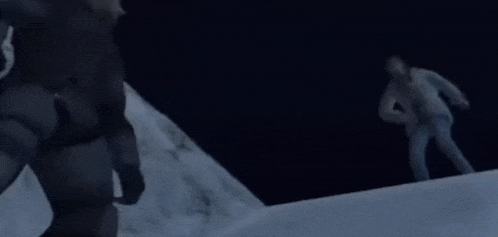 a person is laying on their back in a dark area