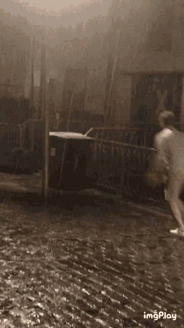 a black and white photo of a flooded area with the words imgplay on the bottom