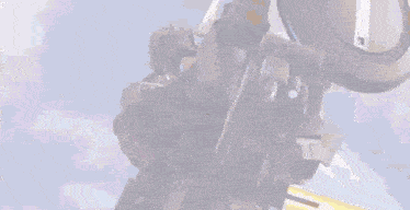 a robot is flying through the air with a blue light coming out of it 's mouth .