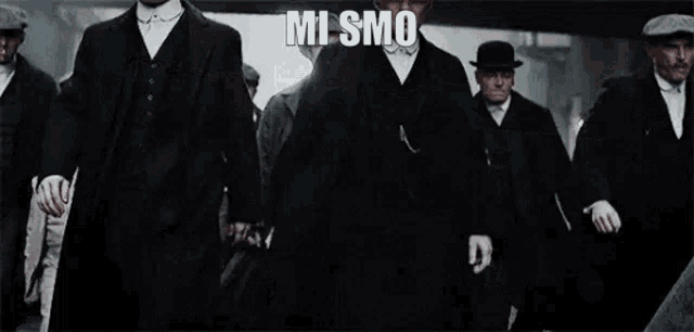 a group of men in suits and hats are walking down a street with a caption that says `` mi smo pedercine21 '' .
