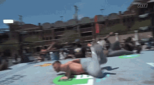 a man in a wrestling ring with the word fitc on the bottom right