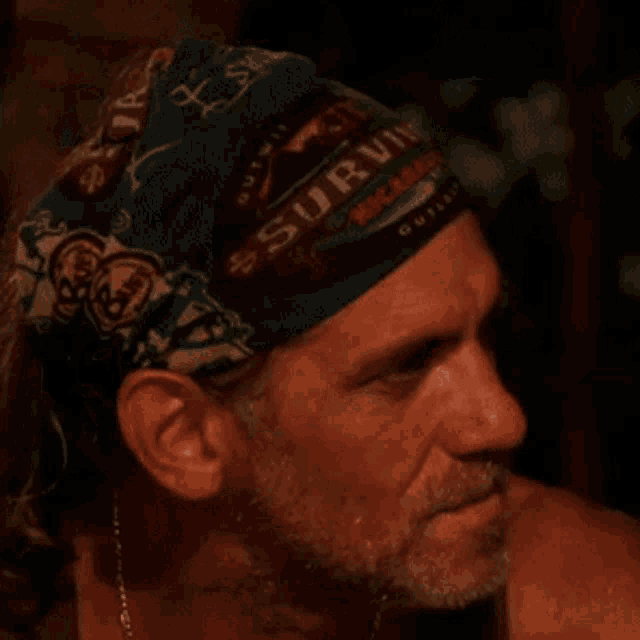 a man with a beard wears a bandana that says south africa