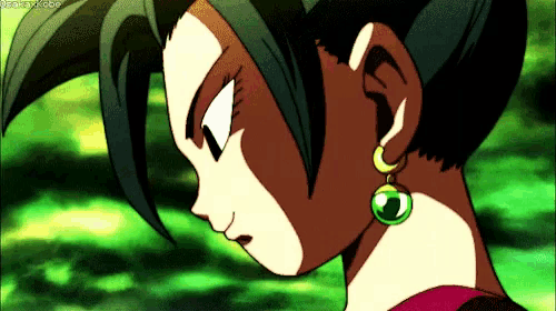 a close up of a woman 's face with earrings on