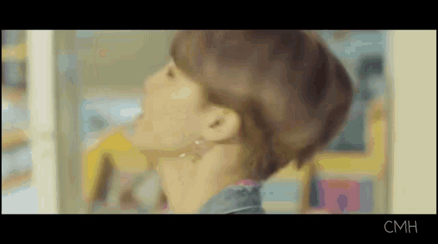 a close up of a person 's neck and ear with a blurry background .