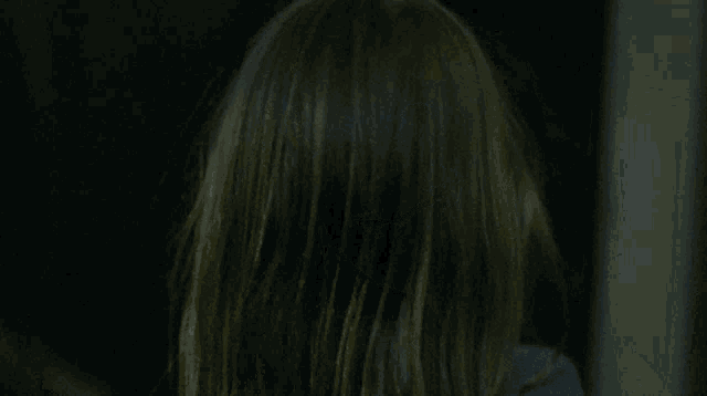 a little girl with black eyes is smiling