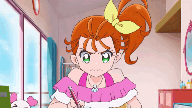 a girl with orange hair and green eyes is sitting at a desk with a pencil in her hand