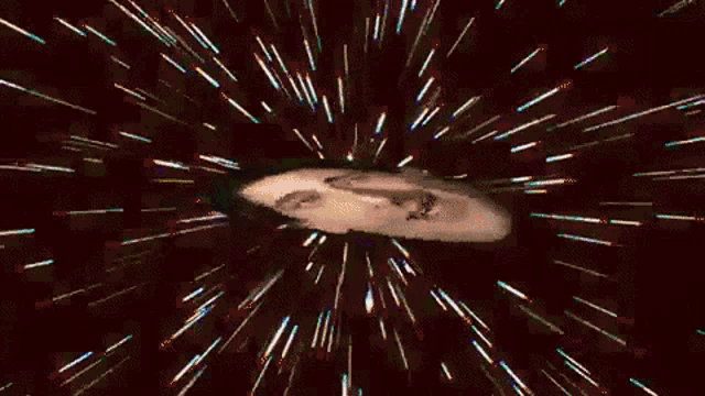 a man in a tuxedo and star shaped sunglasses is surrounded by stars