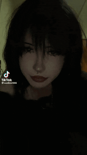 a tiktok video of a girl with black hair