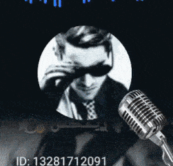a man wearing sunglasses and a tie next to a microphone with the id 13281712091