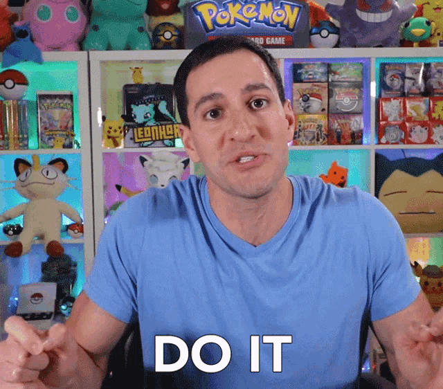 a man in a blue shirt with the word do it on it