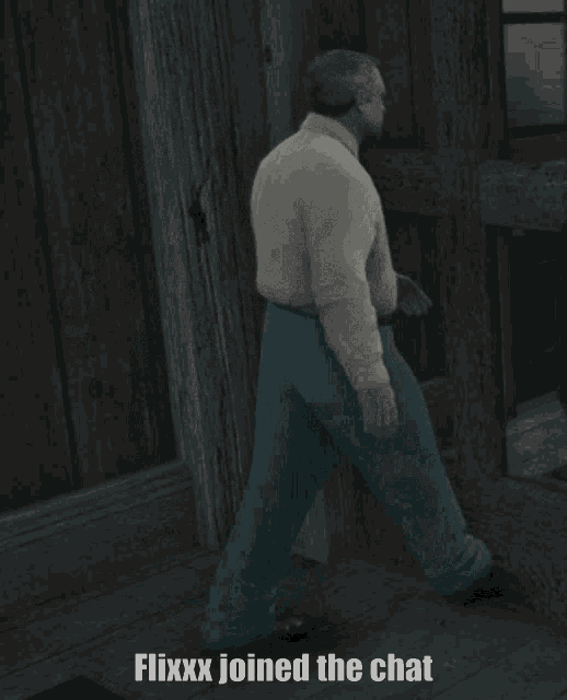 a man in a white shirt and blue pants is standing in front of a door with the words flixxx joined the chat below him