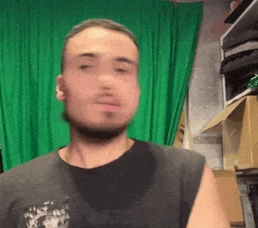 a blurry picture of a man with a green background