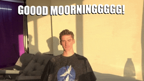 a man in a t-shirt with a bird on it says good morning