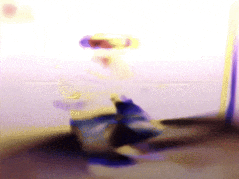 a blurry picture of a person 's face and a purple background