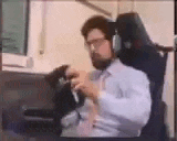 a man with a beard is sitting in a chair wearing headphones .