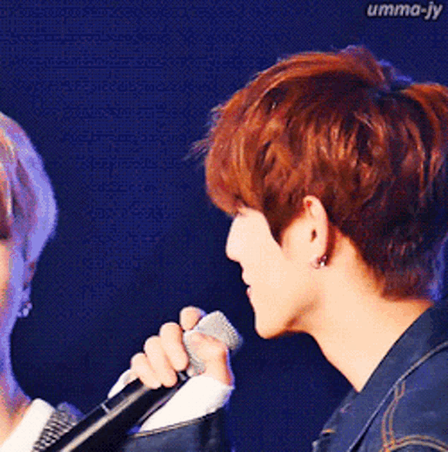 a close up of a person 's face with the name umma-jy written on the bottom