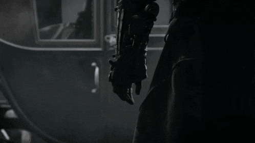 a person is holding a large knife in their hand