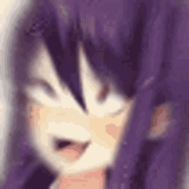 a blurry picture of a girl with purple hair making a silly face .