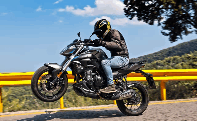 a man is riding a motorcycle with the word racing on it