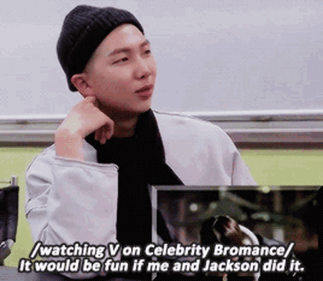 a man wearing a black hat and a white jacket is talking about celebrity bromance