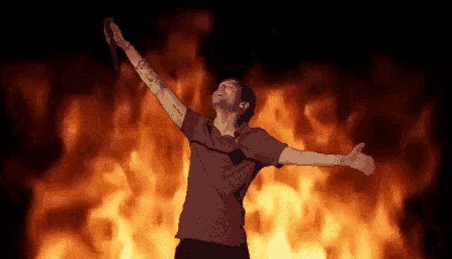 a pixel art of a man holding a microphone in front of flames