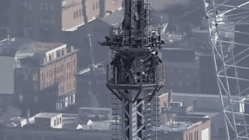 Construction Workers Installed The 408 Foot Spire On Top Of World Trade Center One. GIF - World Trade Center GIFs