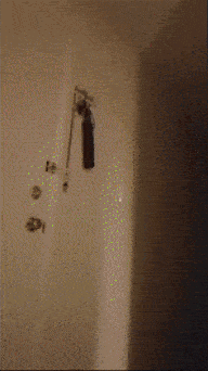 a blurry picture of a person standing next to a cabinet