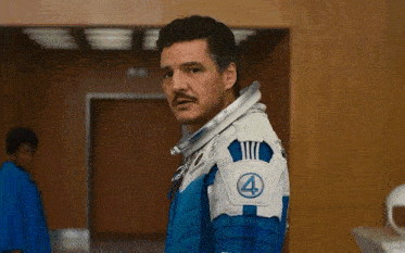 a man in a blue and white space suit with the number 4 on the shoulder