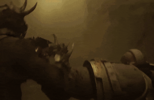 a statue of a bull with horns is surrounded by smoke
