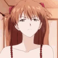 a close up of a girl 's face with a serious look on her face