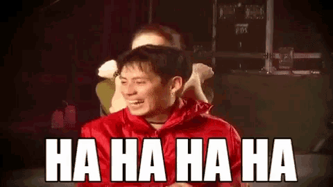 a man in a red jacket is laughing with the words ha ha ha ha in white letters
