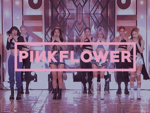 a group of girls are standing in front of a pink sign that says pink flower