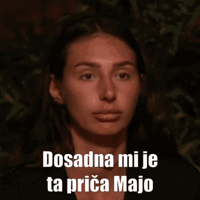 a woman 's face is shown with the words dosadna mi je ta prica majo written below it