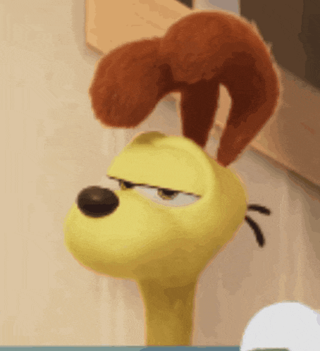 a stuffed animal with a squirrel on its head is looking at the camera